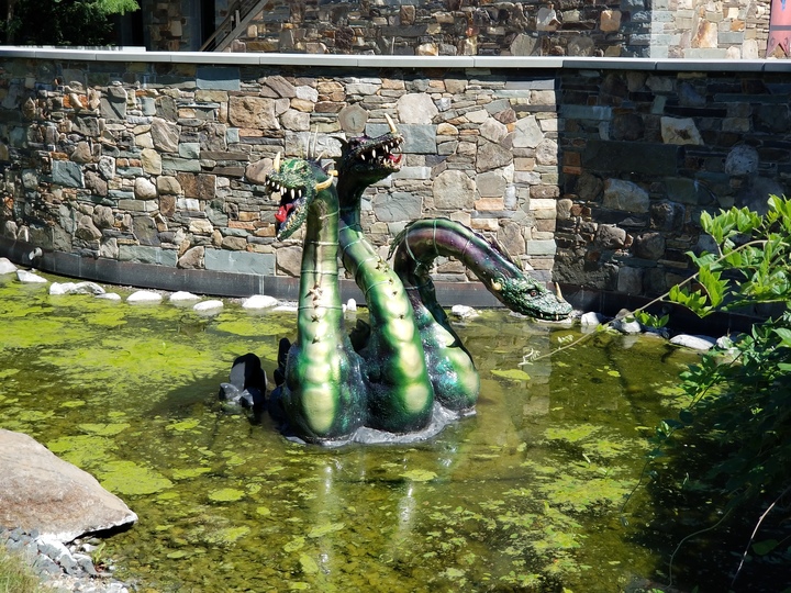 Dragons in a moat outside a building
